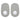 Two gray stickers with white centers are positioned side by side on a surface.